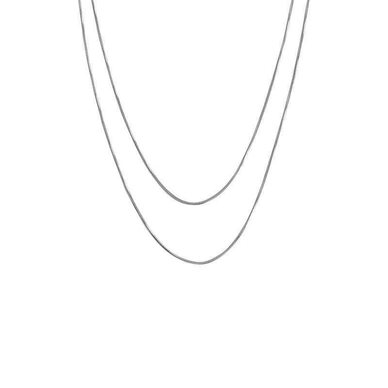A long, layered golden snake bone chain and plain chain necklace with a simple and elegant style. It's a trendy and versatile sweater chain for women Item Picture