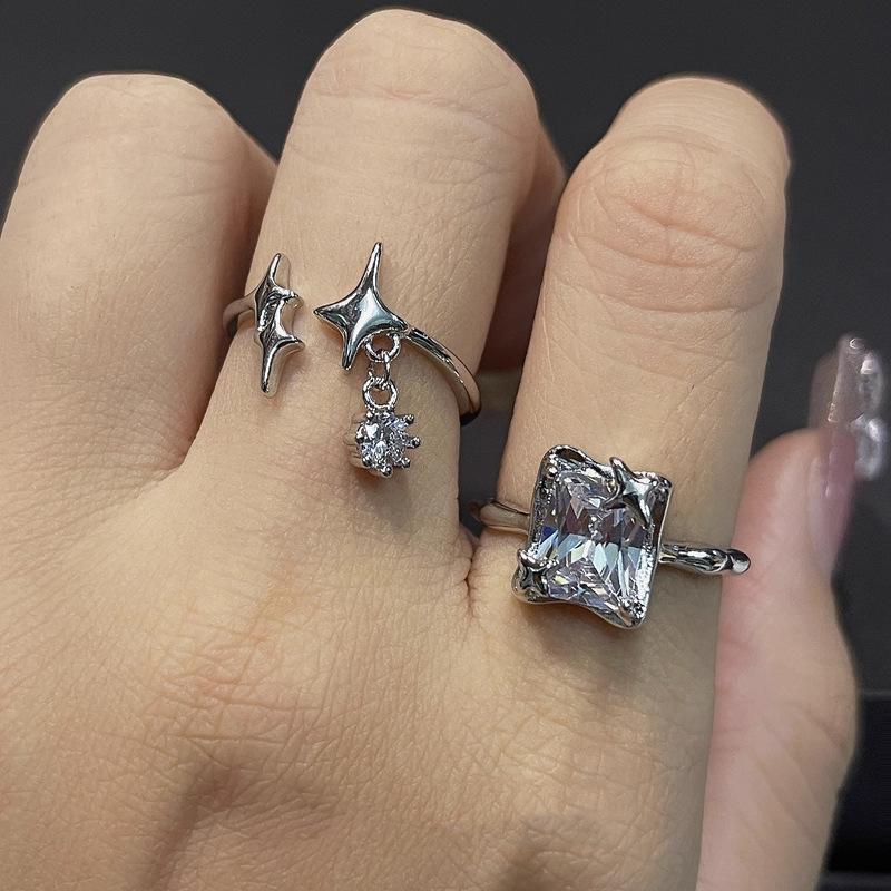This is a niche design of a square sugar zircon star-tipped open ring with a cold tassel style. It is a versatile ring that exudes a sense of luxury and sophistication when worn in layers details Picture