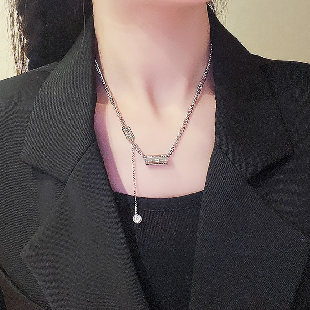 This is a fashionable and elegant hip-hop style necklace with geometric letter pendants from Europe and America. It won't fade and is a trendy accessory for women details Picture