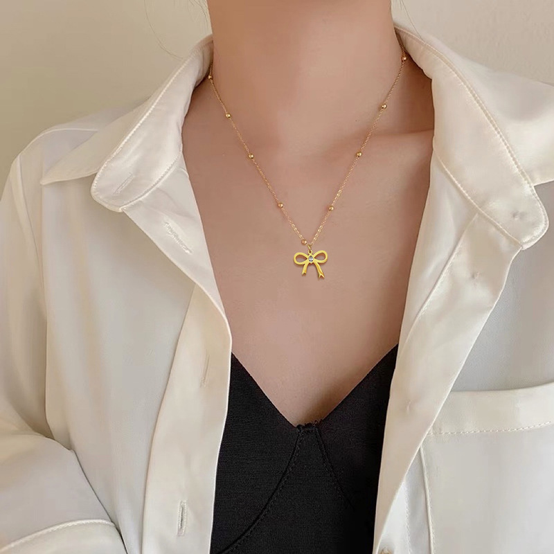 【 Titanium Steel throughout 】 Zircon bow, simple style furnace, real gold necklace, female Instagram influencer collarbone chain accessory details Picture
