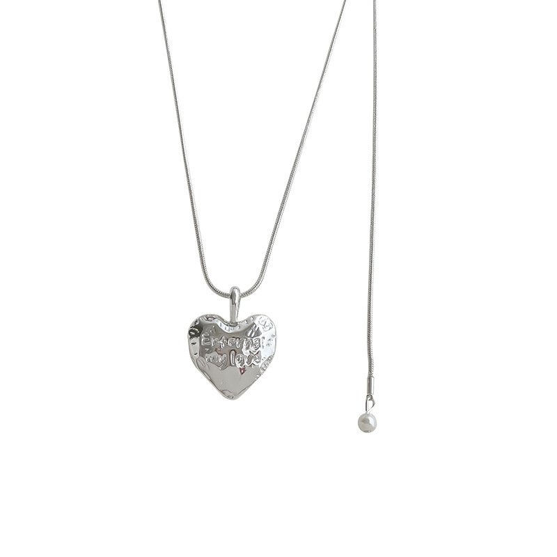 The Korean heart-shaped pendant necklace for women exudes a simple and elegant charm in 2024. It's a versatile long sweater chain accessory trend Item Picture