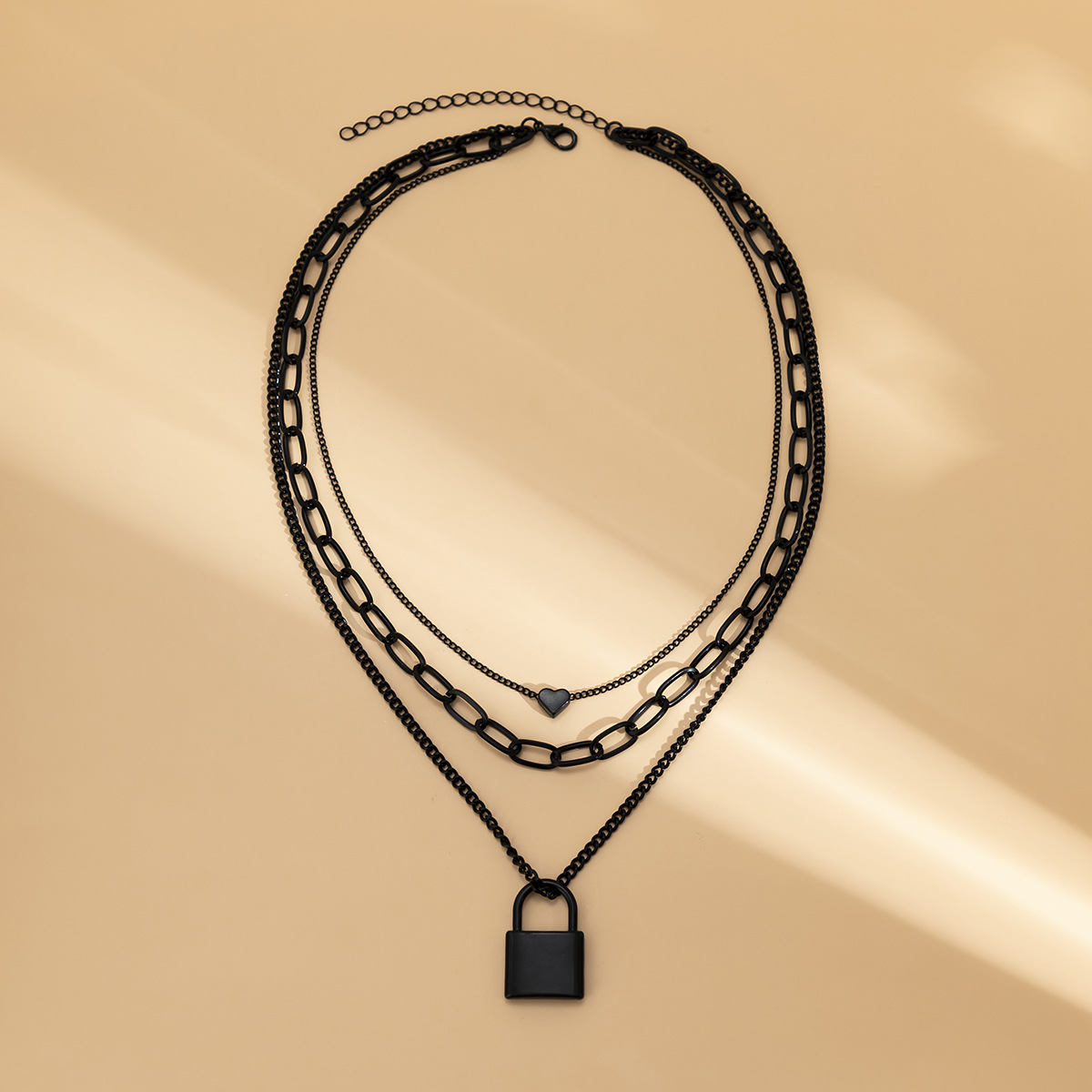 A sweet and cool geometric heart-shaped lock-shaped necklace with a dark punk style from Europe and America, featuring a black cross-chain layering necklace Application Scenario