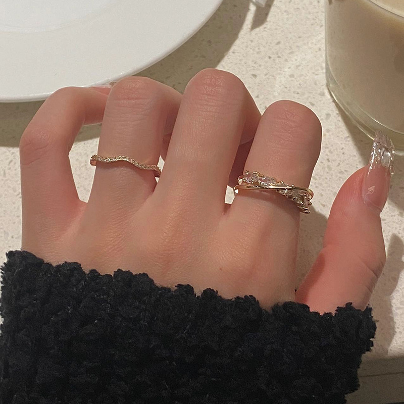 A niche design of a light luxury layered ring for women on Instagram, with a cold style and a high-end feel. It's versatile and set with zircon, featuring an open food ring full figure