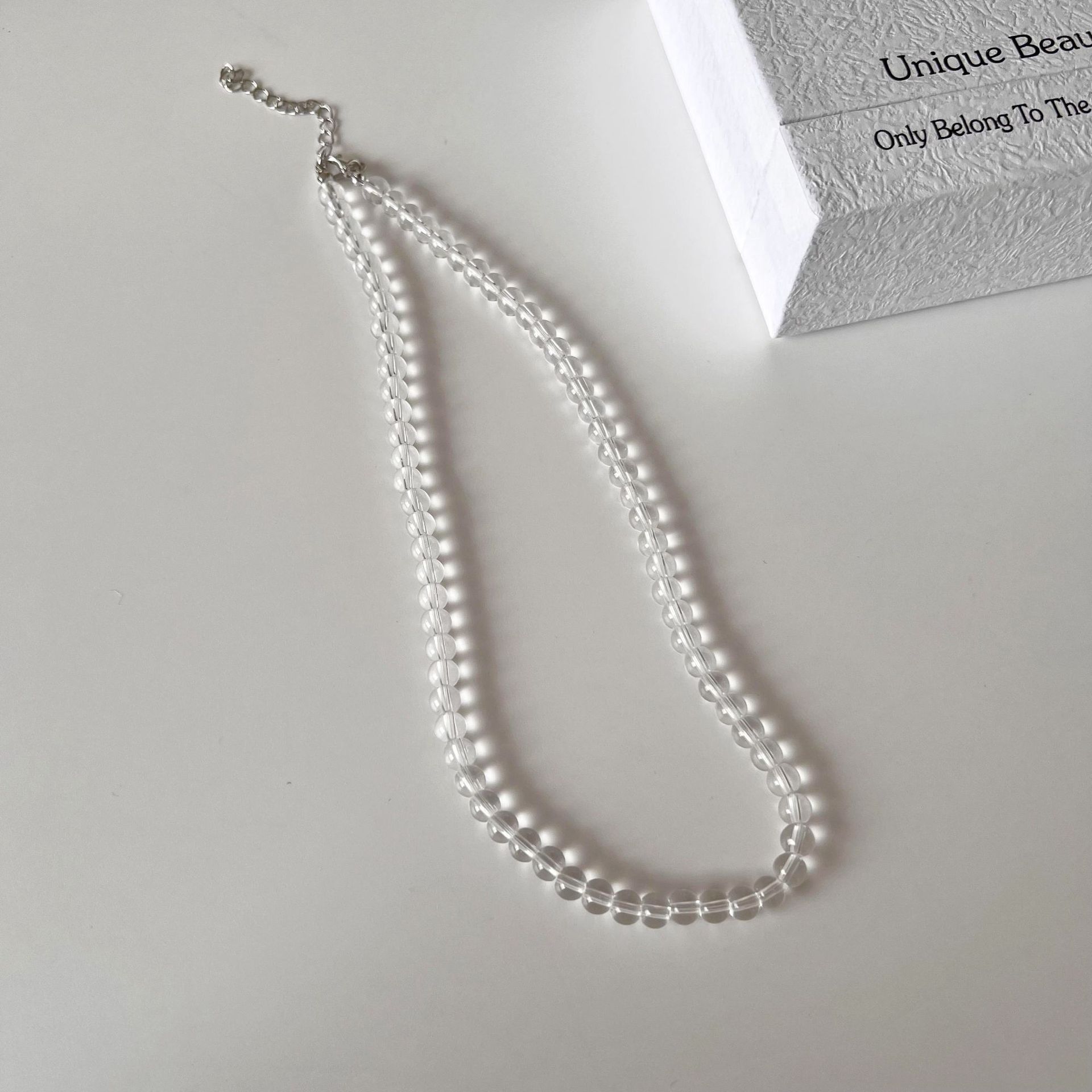 Summer ice-like white crystal glass high-transparency necklace, a niche design for women, versatile and simple round bead collarbone chain necklace for women details Picture