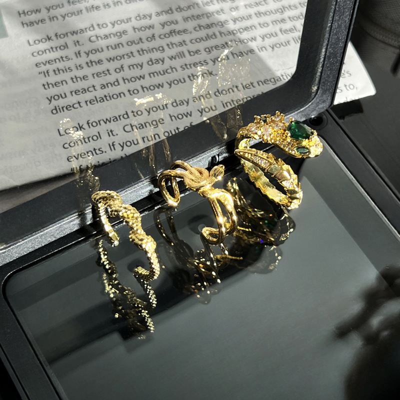 A green diamond snake-shaped brushed opening ring in the style of Chinese fashion for women, a delicate and versatile index finger ring wrapped around the zodiac year's spirit snake details Picture