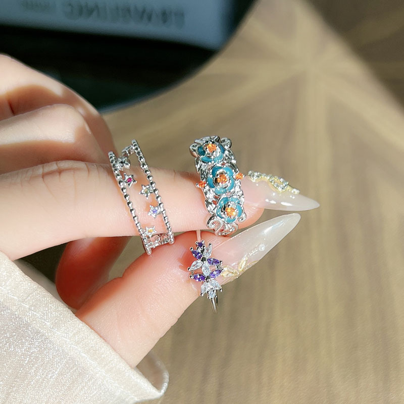Luxurious retro ethnic style flower pleated ring for women, fashionable hollowed-out star style, European and American adjustable index finger ring full figure