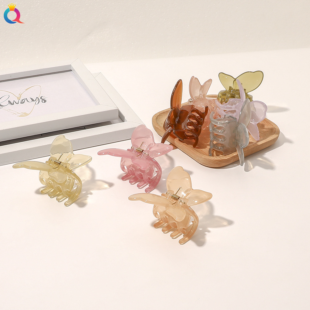 The Qiyue Korean 3D jelly-colored butterfly hairpin exudes an elegant charm and is designed to hold the back of the head with a hair clip and hair accessory details Picture