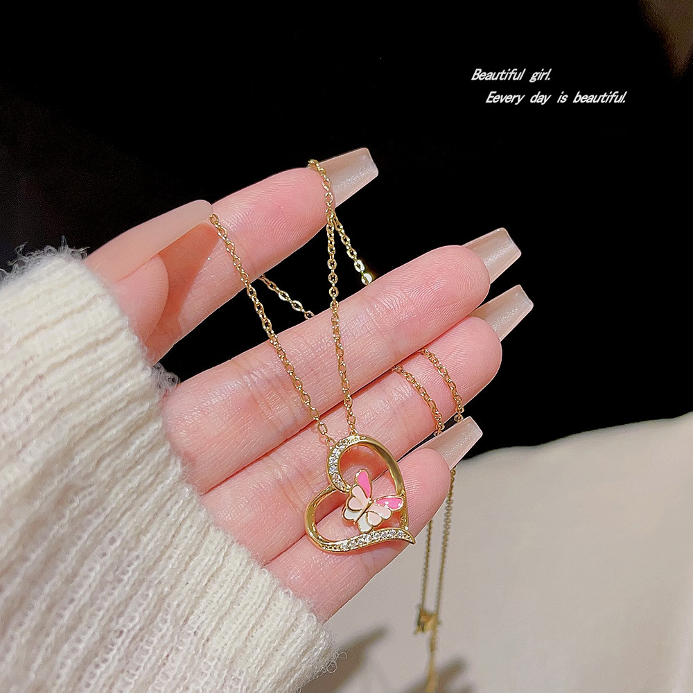 Sweet and heart-shaped necklace, a niche design for women, colorful butterfly pendant, collarbone chain, new 2024 sweater chain accessory Application Scenario