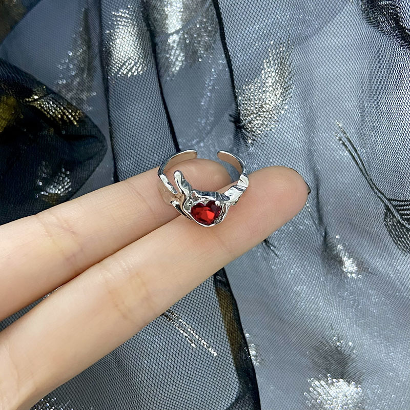 This unique and elegant design features a heart-shaped red diamond zircon lava texture with an open ring. It's a sweet, light luxury and individualistic ring for women details Picture