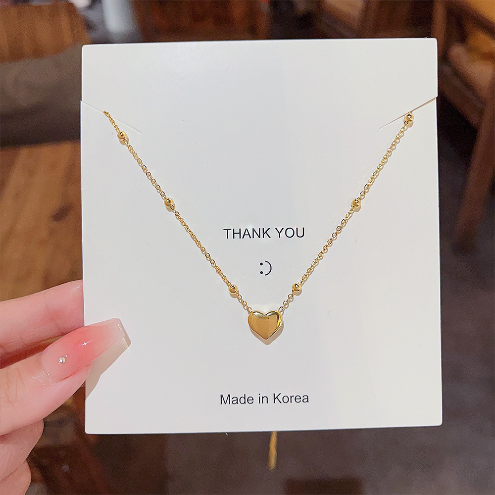 A Japanese and Korean style titanium steel non-fading heart-shaped necklace for women, a light luxury and niche hot girl sweater, a glass bead chain, a winter bestseller necklace details Picture