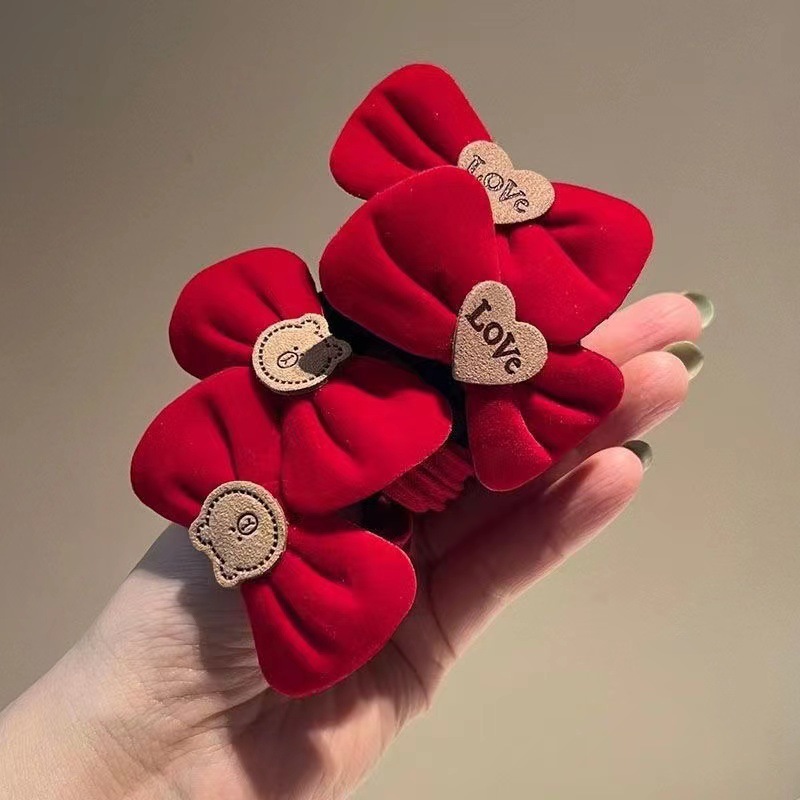 Red bow tie hair band for the New Year, New Year headwear, high-elasticity rubber band ponytail hair tie, children's festive hair accessories Application Scenario