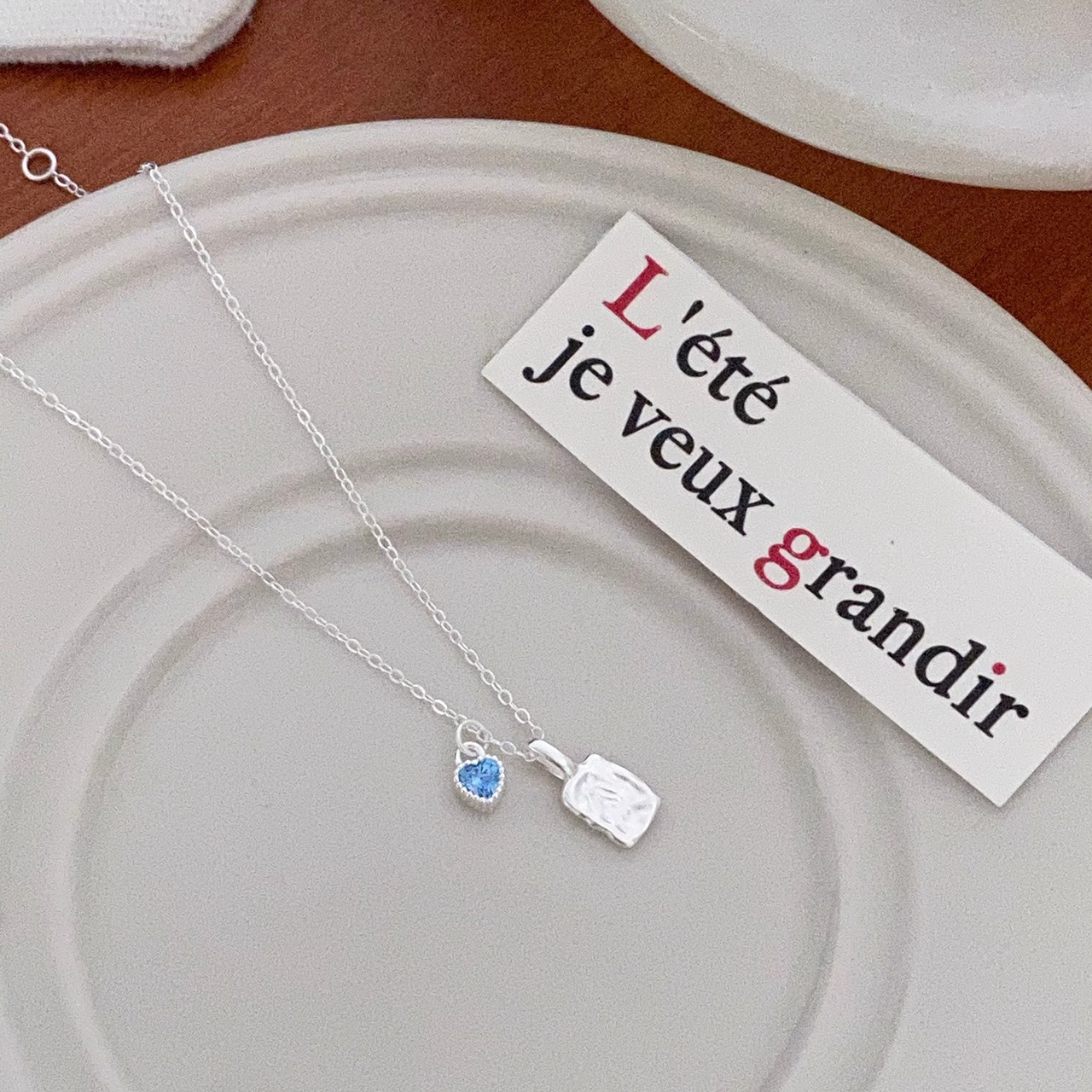 Simple, niche, irregularly textioned square pendant, blue zircon heart-shaped necklace, versatile collarbone chain for women Application Scenario