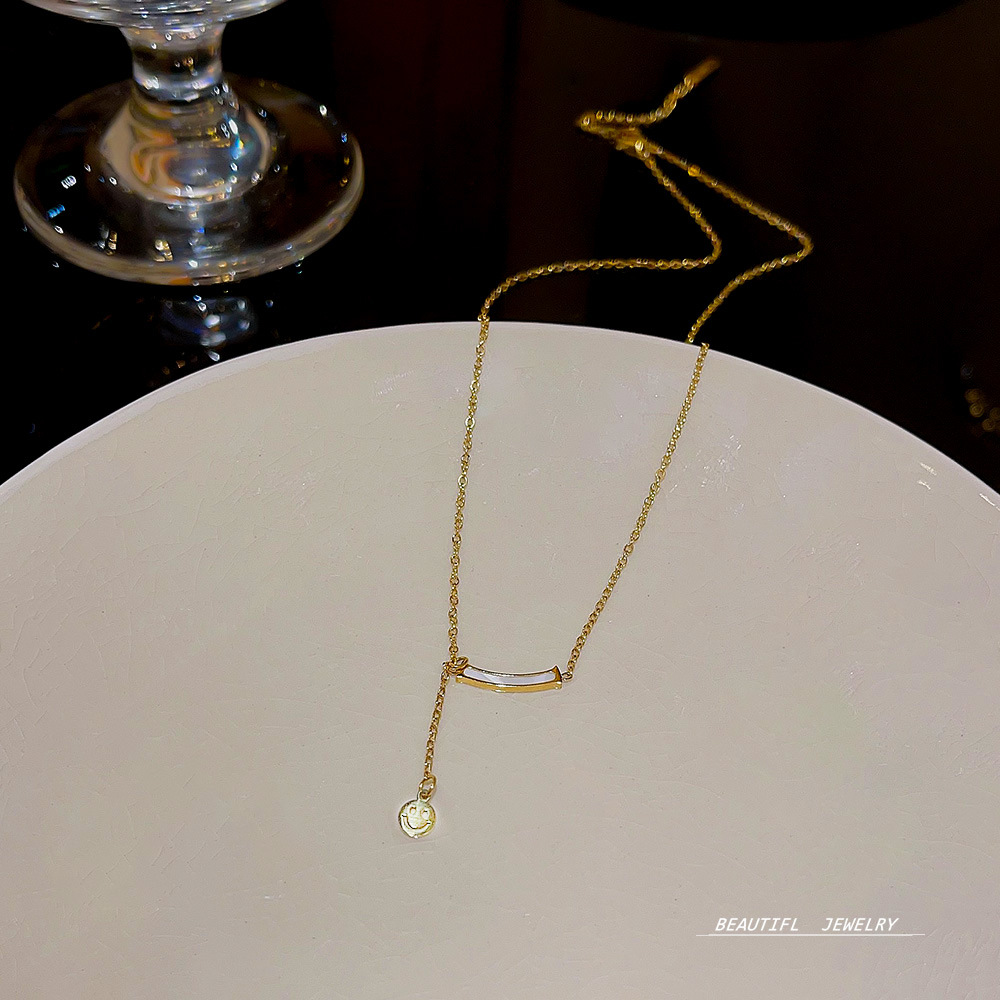 Titanium steel non-fading ins smiley face tassel necklace, non-fading light luxury niche design sense, fashionable and versatile collarbone chain details Picture