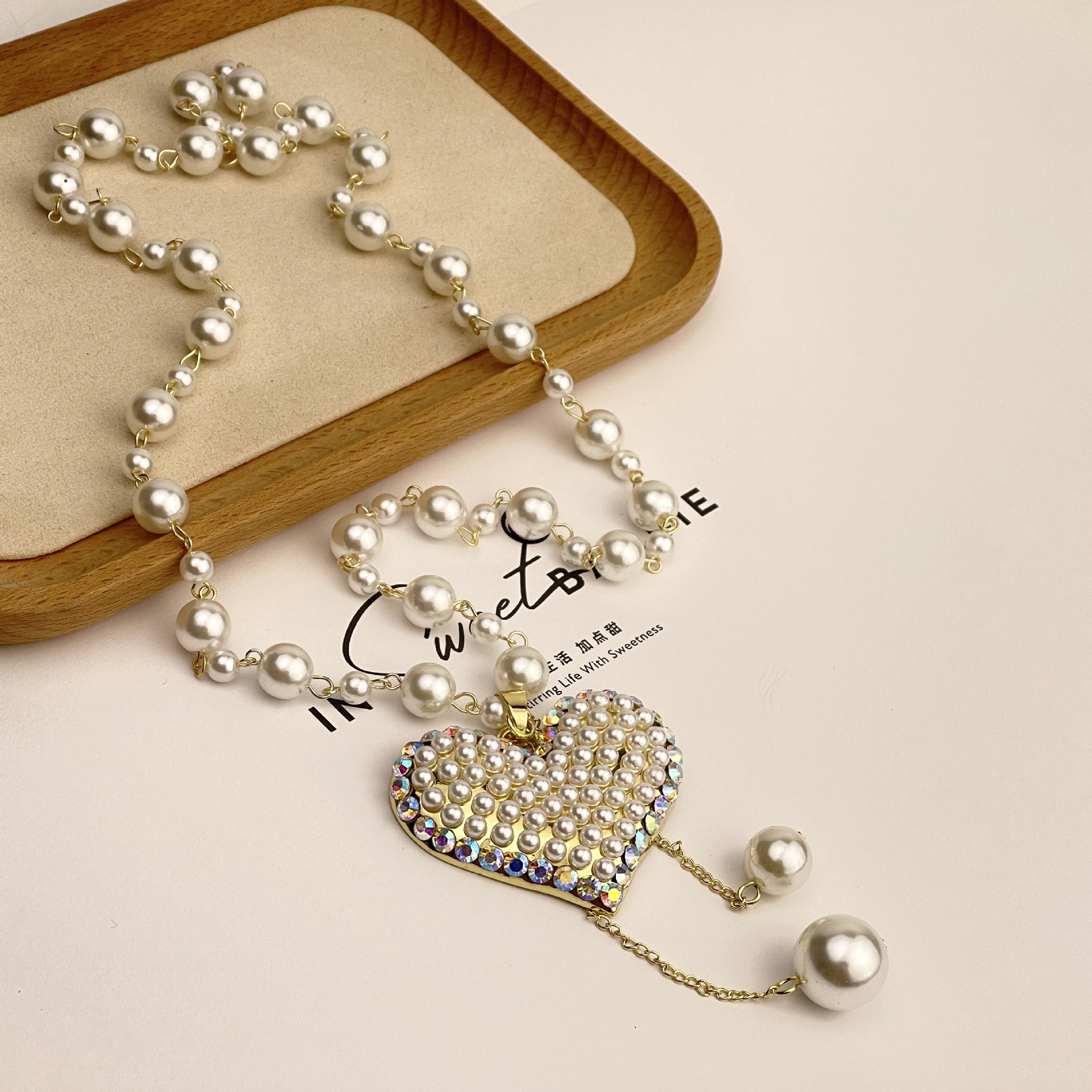Wholesale of new tassel pearl heart-shaped necklace with a fashionable and individualistic touch, long pearl sweater chain pendant Specification drawing