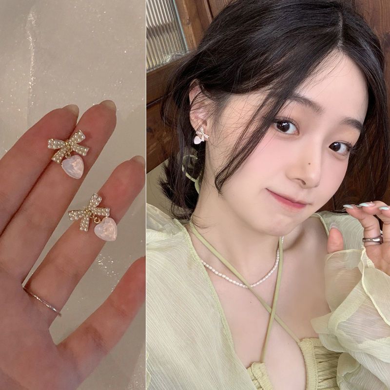 Bow heart-shaped pearl earrings for women, 2025 new stud earrings, ins, niche, gentle, elegant and high-end earrings full figure