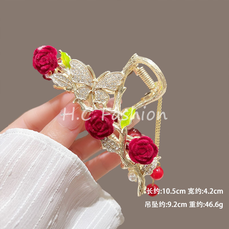 The new elegant chanel-style hair clip exudes a sweet and feminine charm. It features a rose flower grab clip, a stepping tassel, and a shark clip details Picture