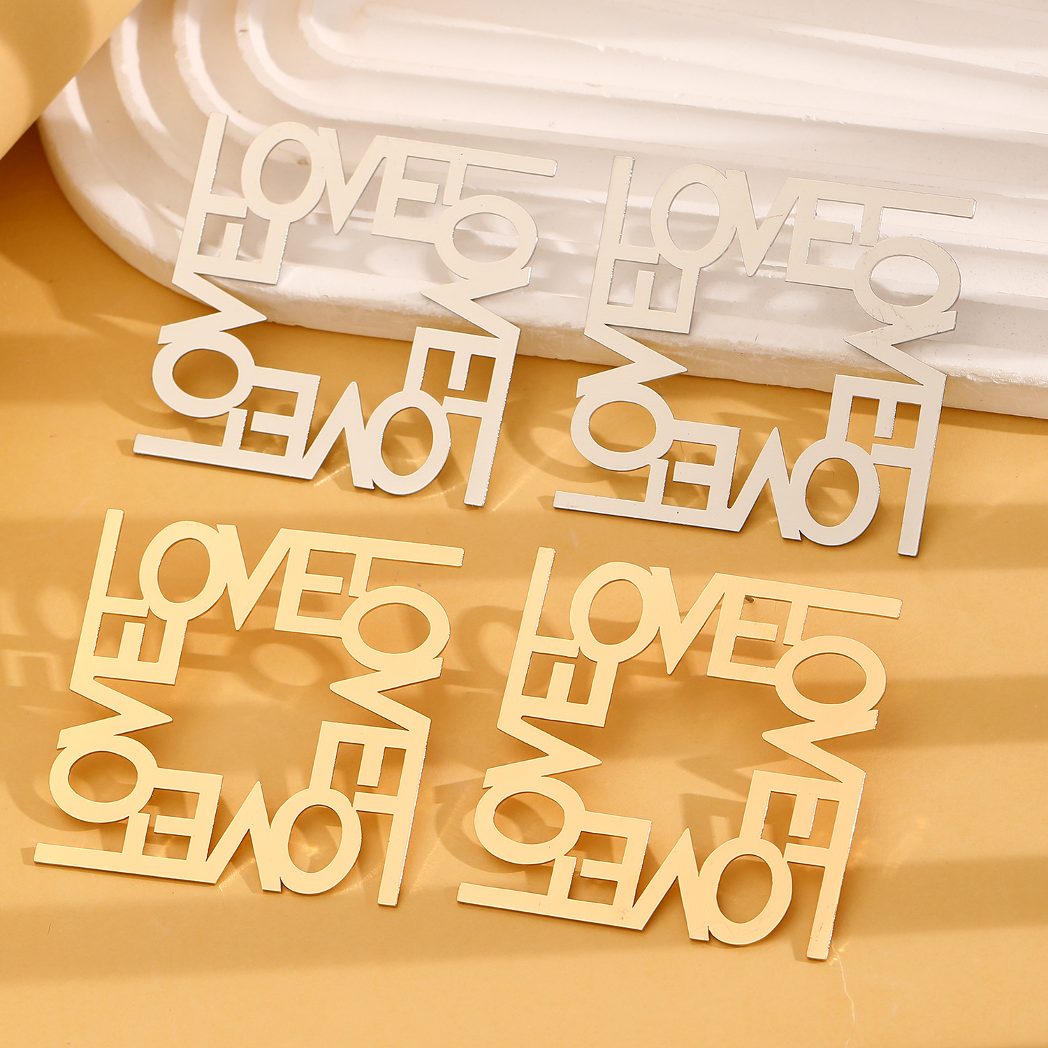 European and American cross-border jewelry, fashionable and exaggerated earrings, LOVE cut letter, high-end and simple earrings, geometric stud earrings Application Scenario