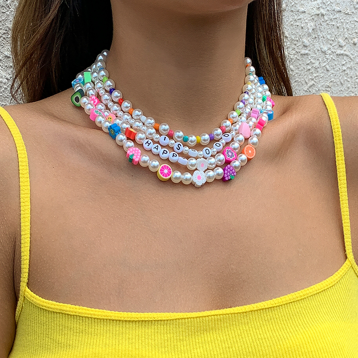 A pastoral and fresh, color-blocking fruit soft clay layered necklace, a retro European and American imitation pearl acrylic letter collarbone chain full figure