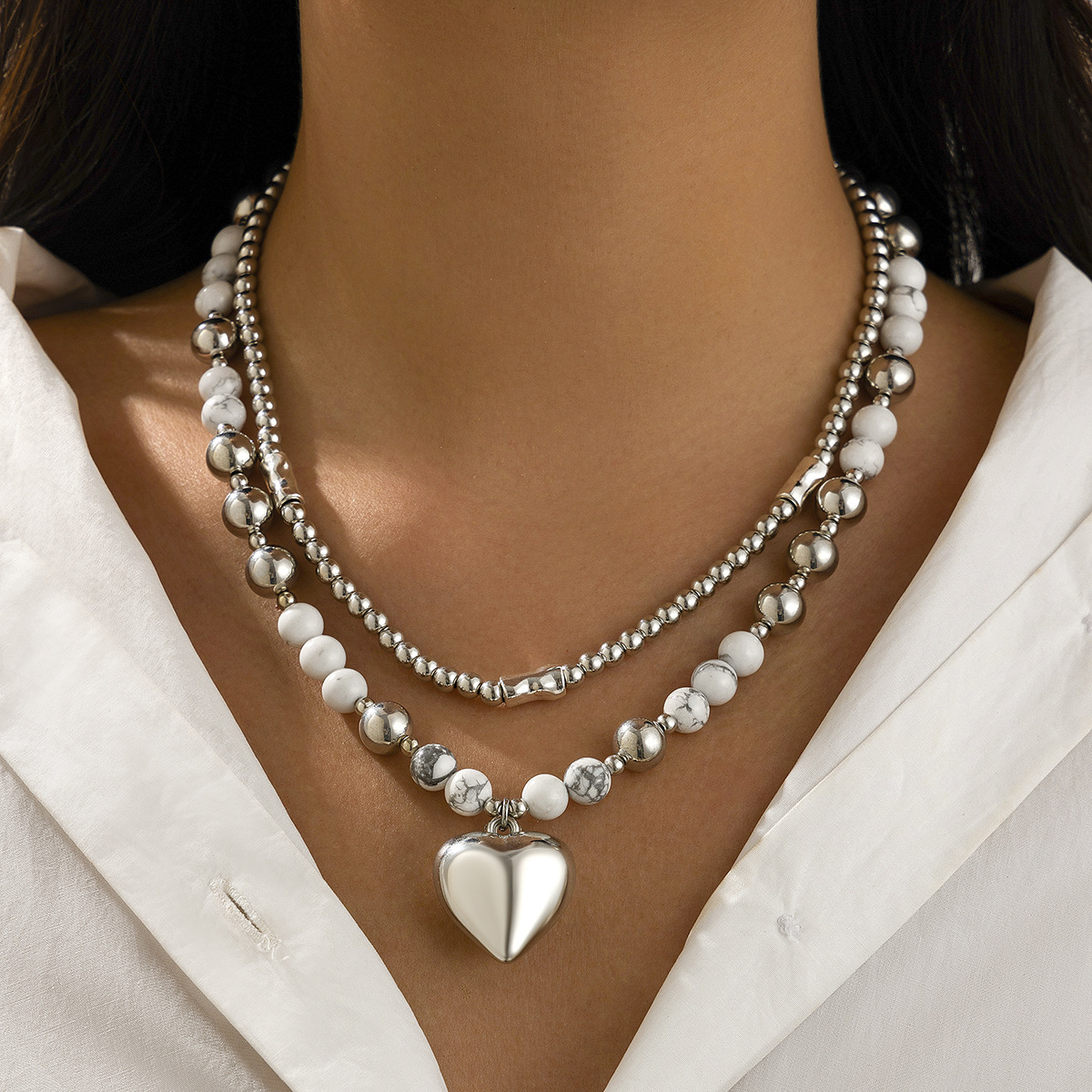 European and American cross-border jewelry, hollowed-out versatile bead collarbone chain, simple multi-layer heart-shaped alloy pendant necklace set full figure