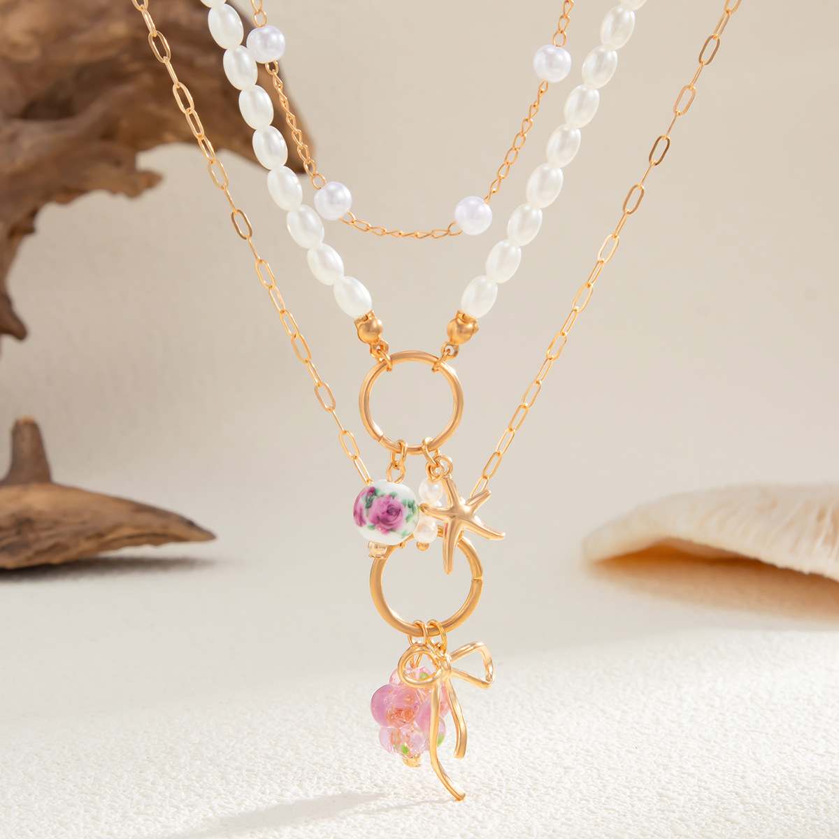 European and American cross-border jewelry, fashionable ins bow starfish multi-layer necklace, simple imitation pearl beaded necklace Application Scenario