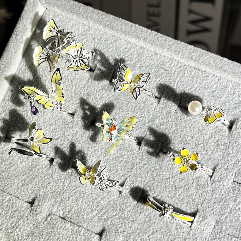 A Korean-style trendy mixed forest-themed yellow glazed butterfly flower open ring for women, with a light luxury and high-end feel Application Scenario