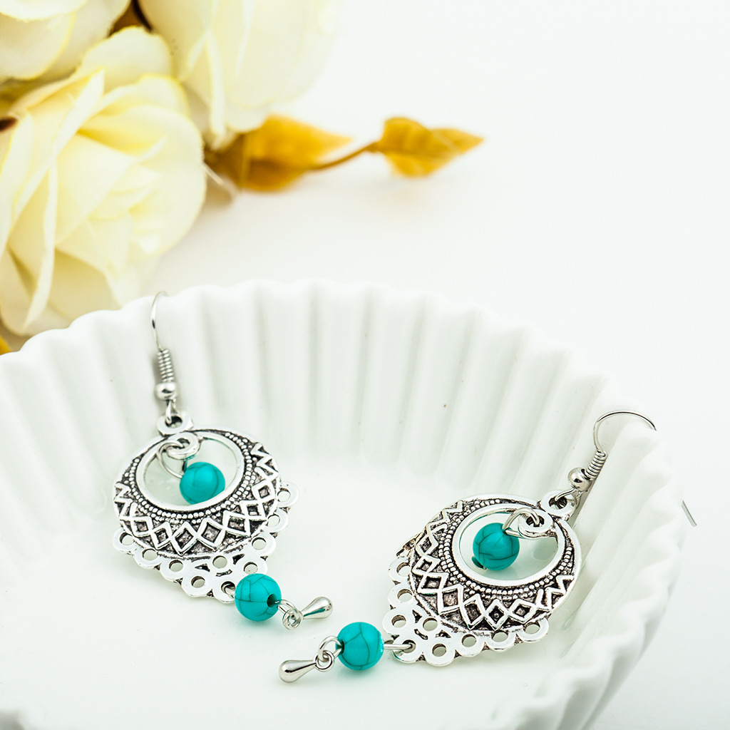 Wholesale of European and American fashion retro ethnic style hollowed-out turquoise water drop earrings and Bohemian tassel stud accessories Specification drawing