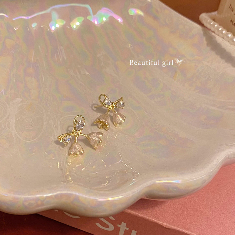 Korean-style lily of the valley bow earrings for women in spring, a unique and versatile style, zircon stud earrings, a best-selling accessory wholesale Specification drawing