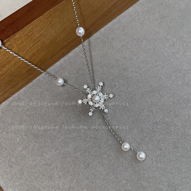 Autumn and winter snowflake tassel pearl necklace for women 2023 new style sweater chain, light luxury and niche collarbone chain full figure