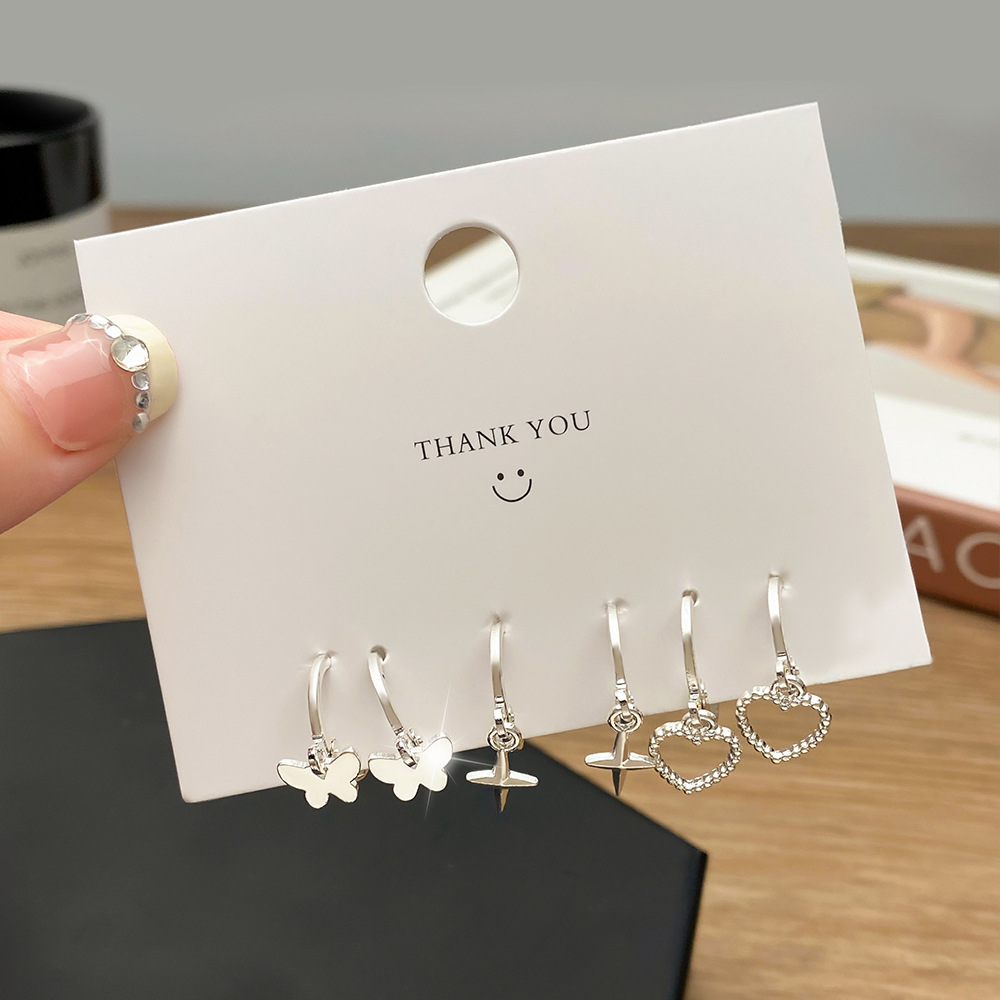 European and American cross-border best-selling fashion trend oil-dripping heart-shaped butterfly imitation pearl earring set for women earrings Application Scenario