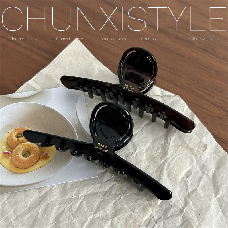Very unique and stylish ~ French retro black amber niche hair clipper with a moderate amount ~ Acetate shark clipper details Picture