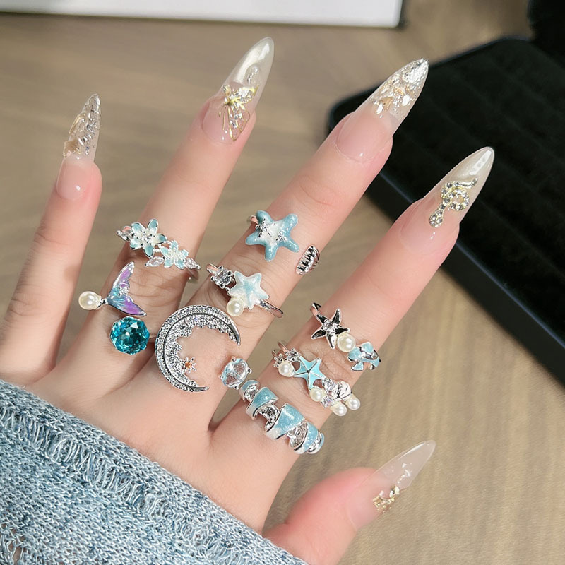 The new ice blue series ocean-style starfish tail enamel open ring is a women's vacation style light luxury design ring details Picture