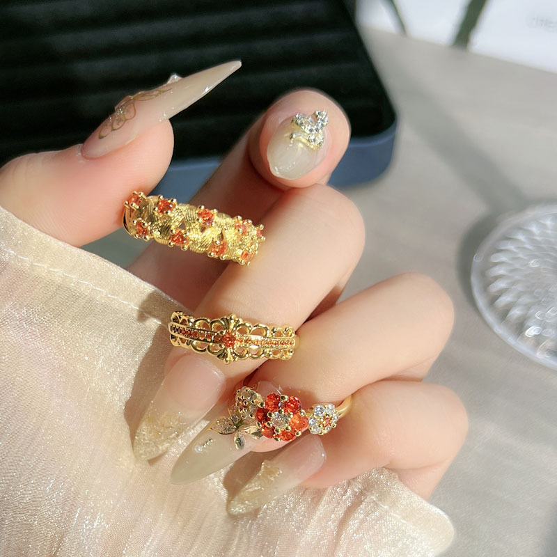 A simple open ring set with orange-red zircon in a mid-style style, featuring a retro brushed flower and a hollowed-out design, exuding a unique and elegant charm details Picture