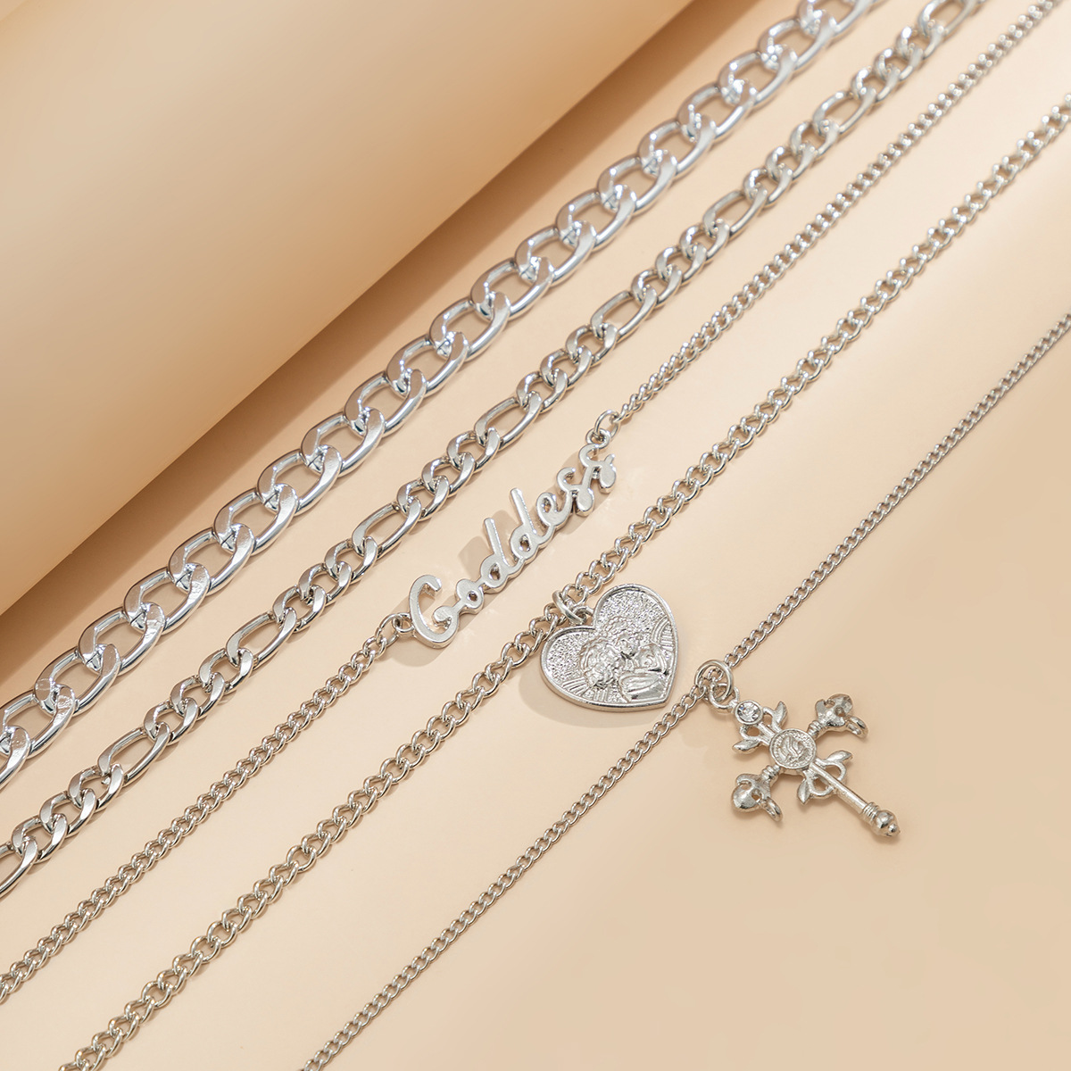 European and American cross-border jewelry, retro multi-layered human figure cross pendant necklace, hip-hop style letter chain necklace for women Application Scenario