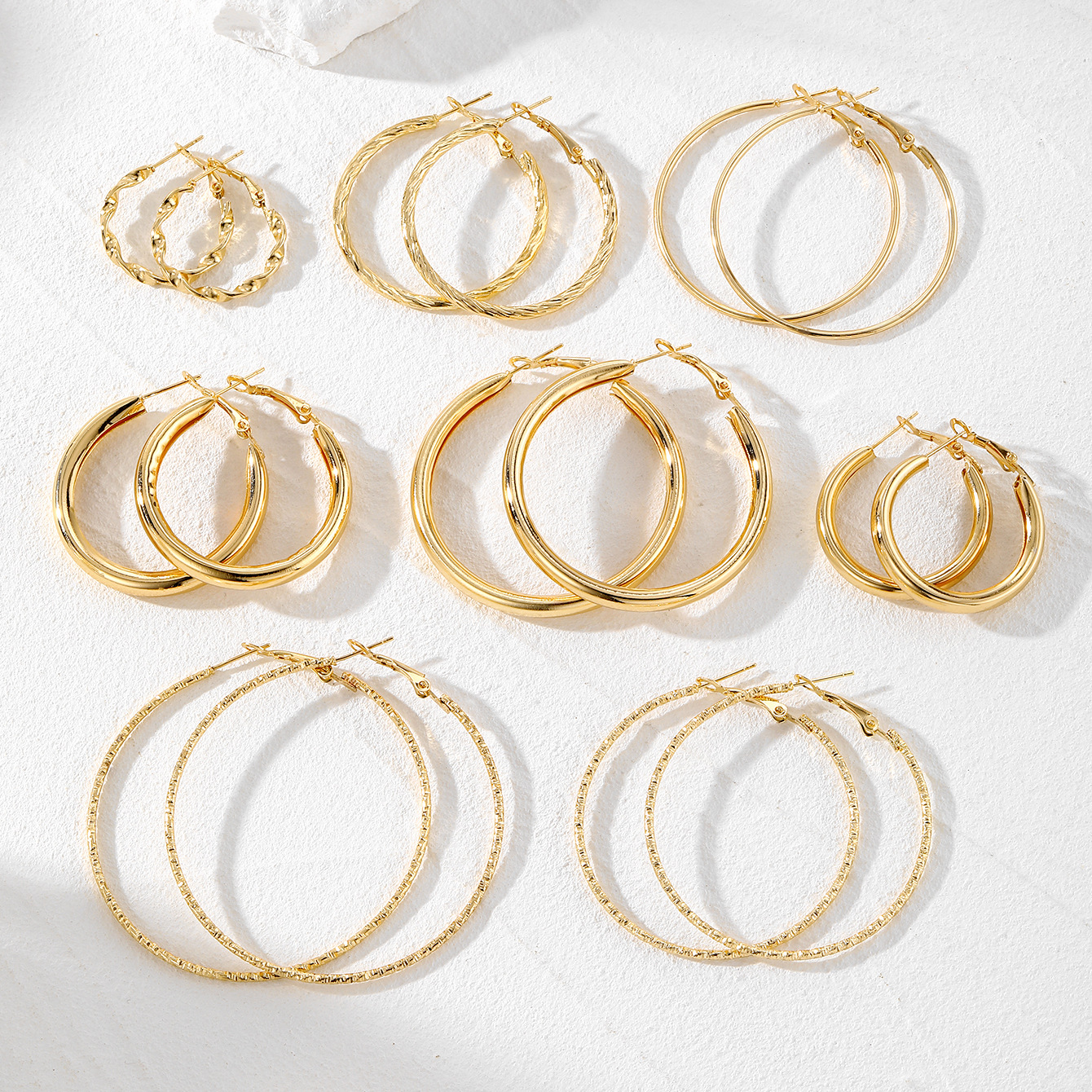 8-piece set of versatile circle earrings with a European and American cross-border hammered pattern, a fashionable commuting large circle earring set full figure