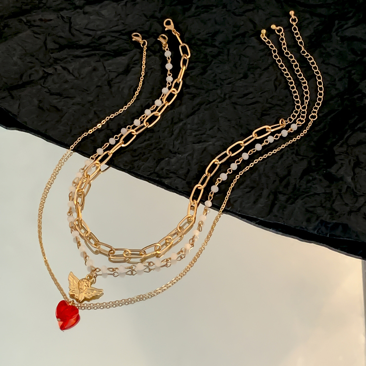 European and American layered style retro little angel pendant, versatile collarbone chain, elegant and fashionable imitation crystal heart-shaped necklace for women Application Scenario