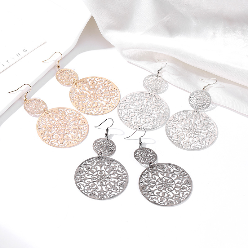Cross-border best-selling European and American fashion earrings, retro hollowed-out round frosted earrings, court ethnic style carved stud earrings details Picture