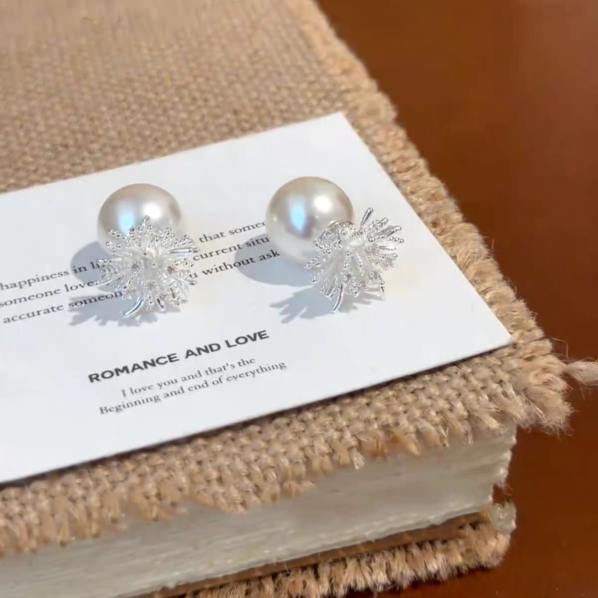 A pair of silver firework pearl stud earrings, a new 2025 bestseller for women, exudes a sense of high-end luxury and elegance Application Scenario