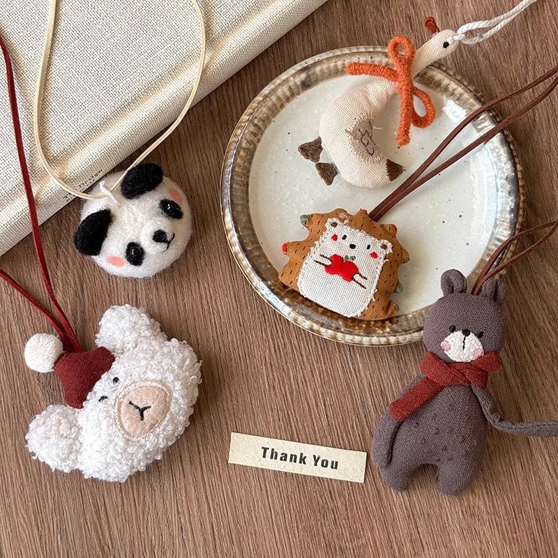 Cartoon and cute plush fabric animal necklaces for women, a niche artistic and retro style sweater chain pendant Application Scenario