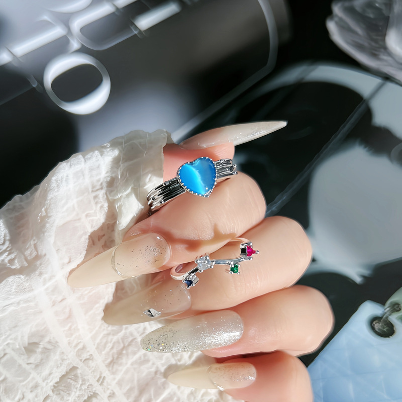 A new, fashionable and niche design open ring made of colored zircon, featuring a sea blue heart and a sweet, cool, and versatile style full figure