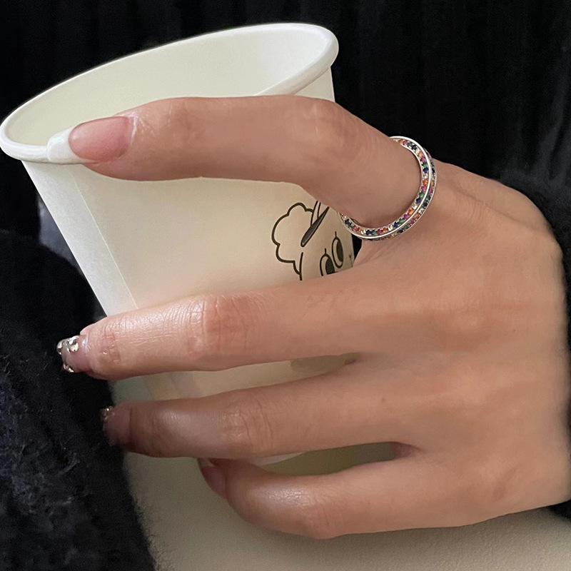 A niche, light luxury, colorful, diamond-encrusted, versatile zircon ring for women, with a fashionable, individualistic and elegant design. It's an open ring with a high-end feel Application Scenario