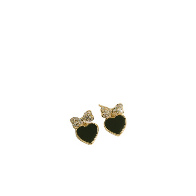 The new 925 silver needle black peach earrings are a favorite among women. The bow stud earrings feature a niche design and a cool style Item Picture
