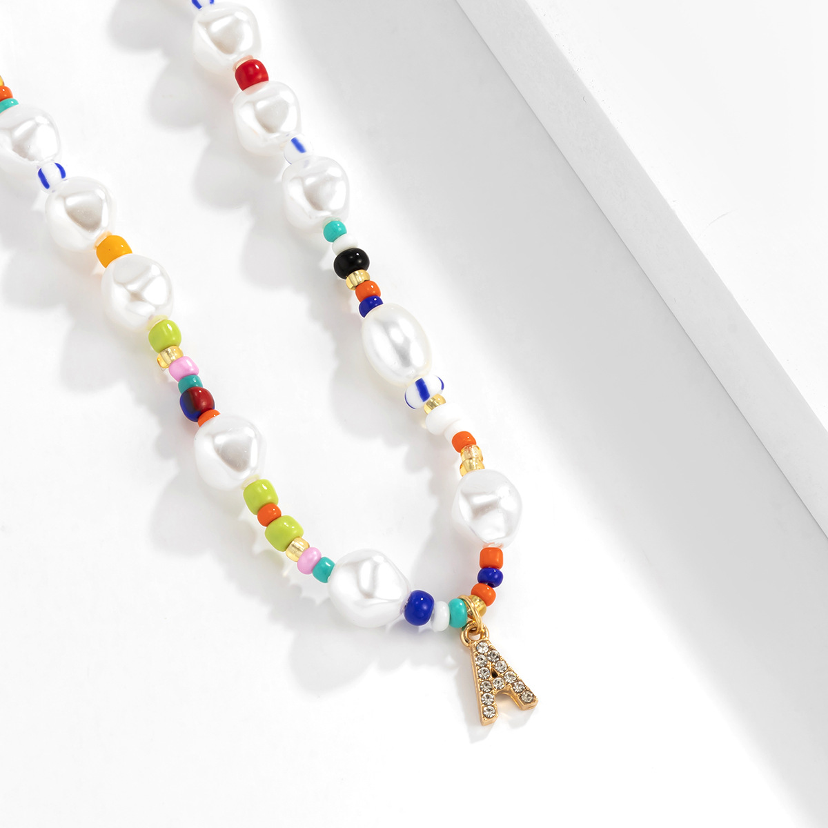 Ethnic style, unique color contrast, pearl-like short collarbone chain necklace, European and American geometric letter A pendant, a niche necklace Application Scenario