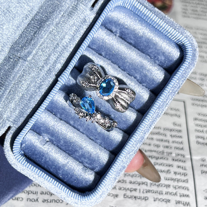 Super Flash Heavy Industry Water Drop Sea Blue Diamond Pigeon Egg inlaid open ring, feminine, niche bow light luxury ring Application Scenario