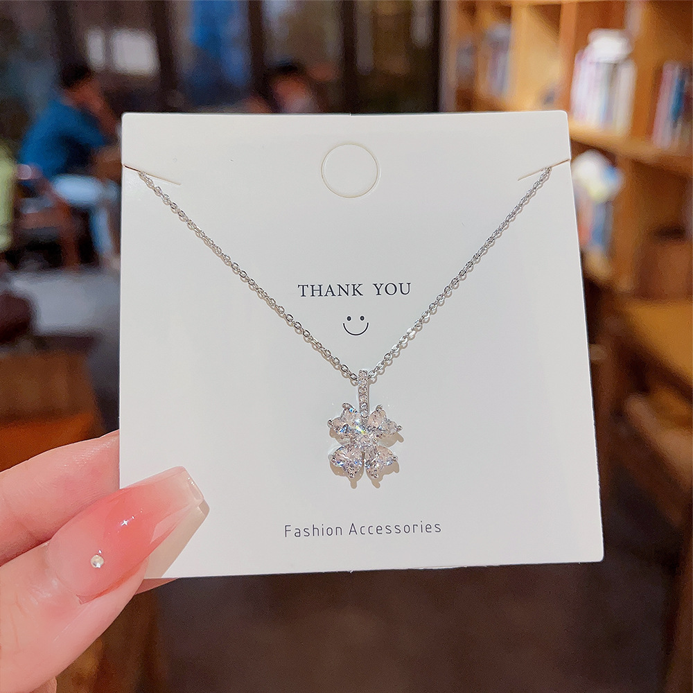 Micro-inlaid zircon flower titanium steel necklace for women, trendy and niche design sense, light luxury pendant, versatile collarbone chain wholesale full figure