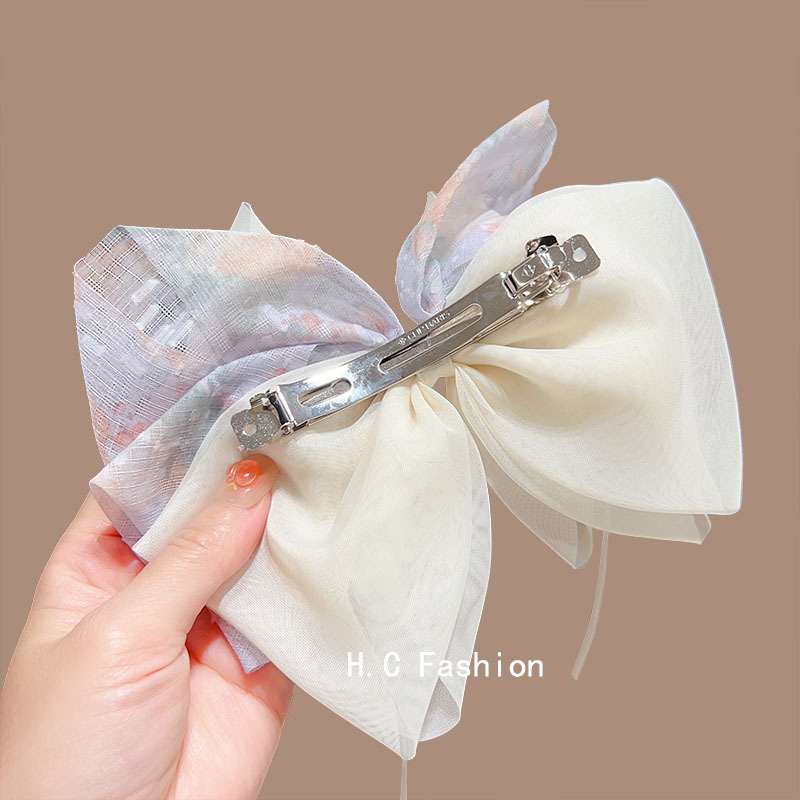 Summer sweet, light luxury and high-end style ponytail clip, new bow spring clip, girlish ribbon mesh hair clip headwear Application Scenario