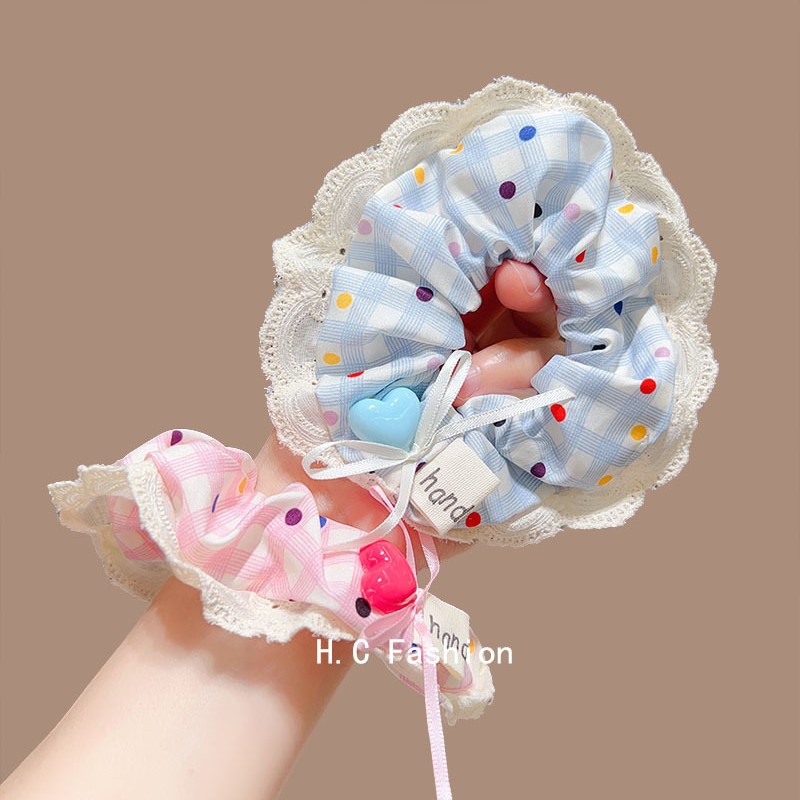 Romantic dopamine pink bow polka dot lace large intestine hair band, a high-end Korean-style sweet hair tie accessory for women Application Scenario