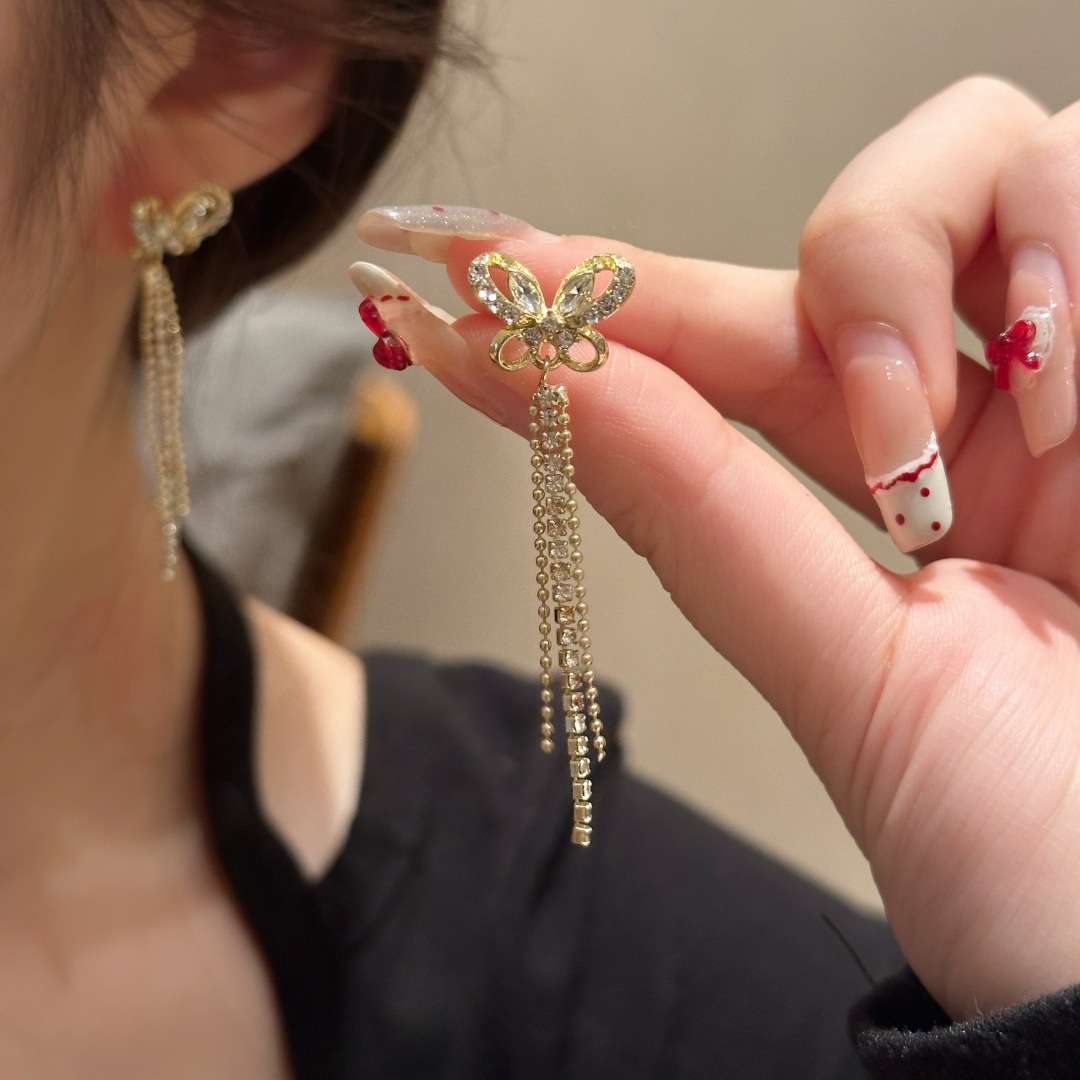 Wholesale of Japanese and Korean light luxury high-end micro-inset zircon butterfly tassel earrings, exquisite, fashionable, versatile and super shiny earrings full figure