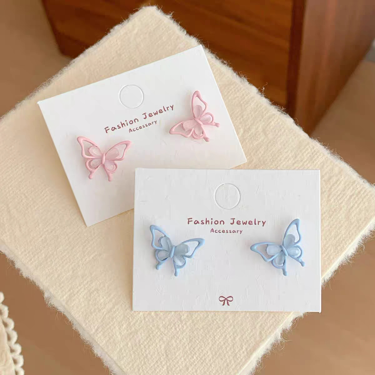 Spring new cat's eye stone powder blue small butterfly stud earrings, women's silver needle, super fairy-like, versatile and sweet three-dimensional earrings for daily use Application Scenario