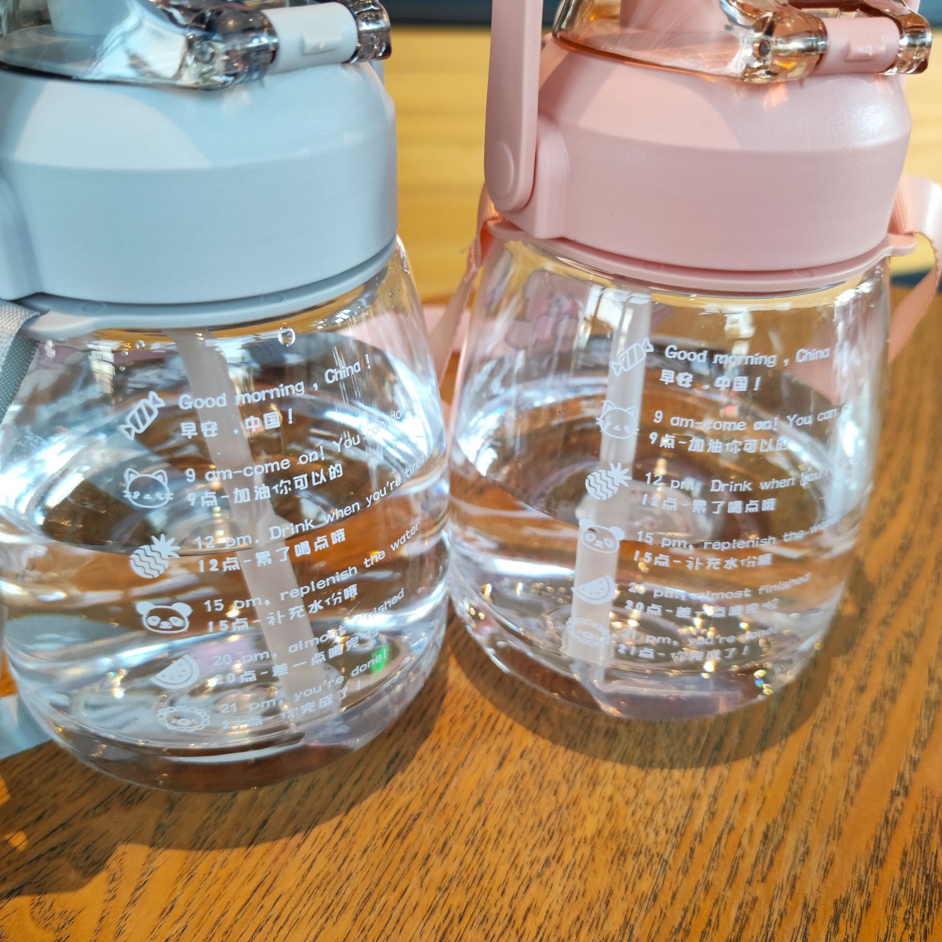 Large-capacity student portable backpack water bottle, children's straw, large-bellied cup with 2D stickers, popular chubby cup 1100ml Application Scenario