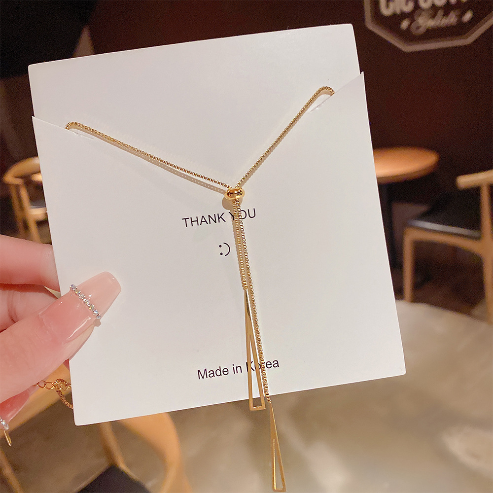 A pull-out geometric tassel titanium steel necklace with a light luxury and niche design sense, a new trendy accessory for 2025 details Picture